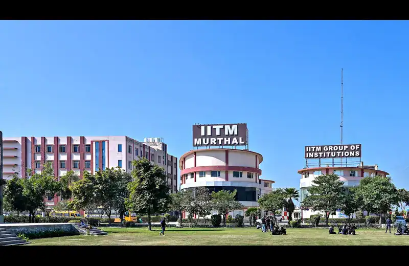 IITM Murthal campus building exterior view with students and greenery